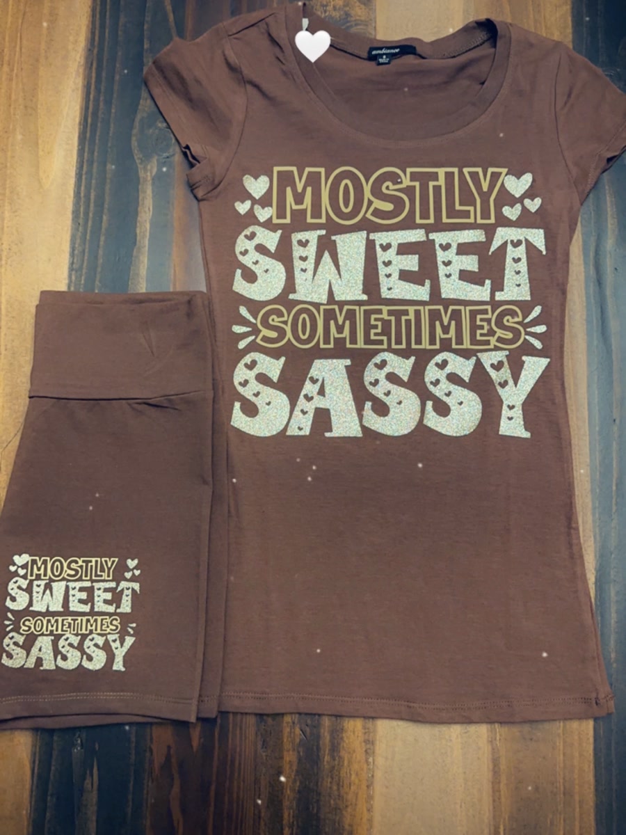 A brown lounge set printed with mostly sweet, sometimes sassy in cream retro lettering.