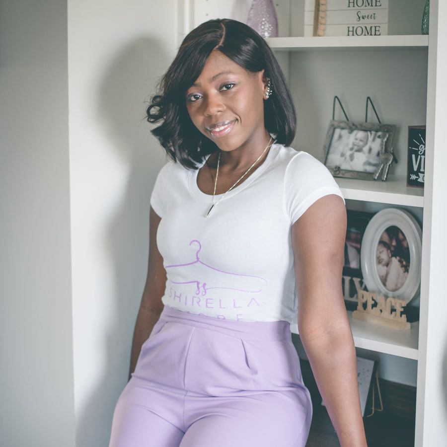 Bry standing in her home studio wearing a Shirella Store tee.