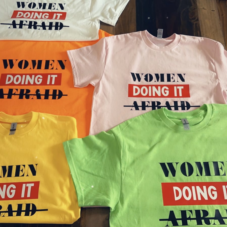 The same design pressed onto shirts in six different colors.