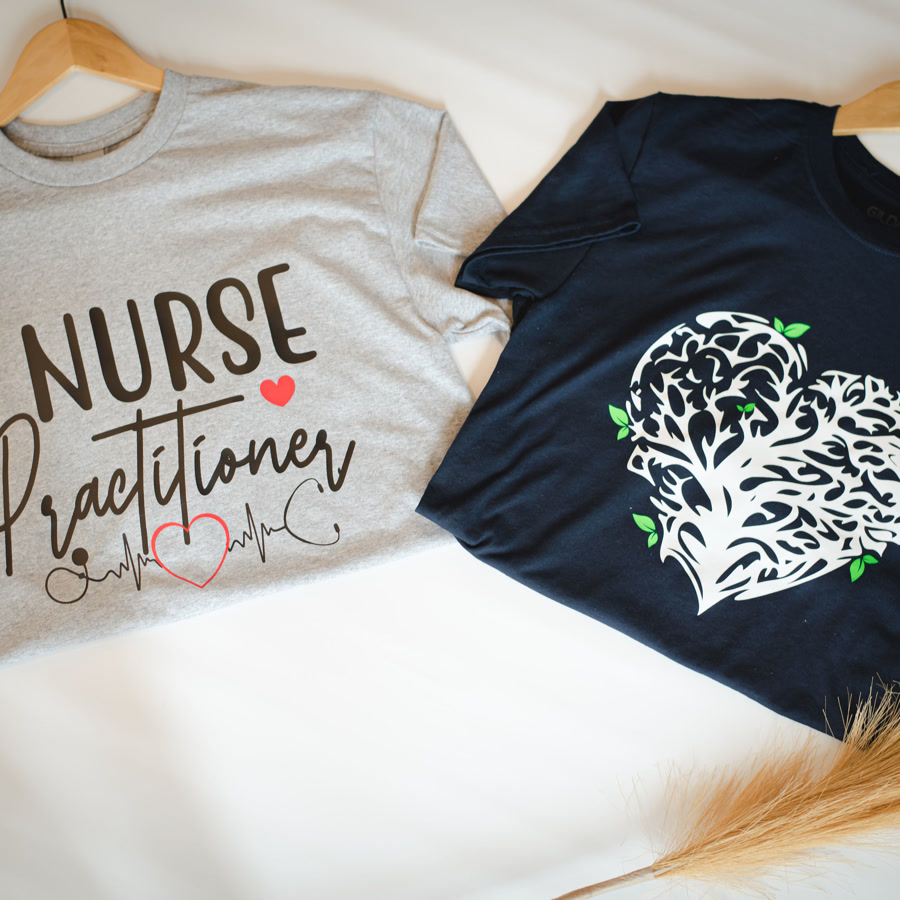 Two shirt designs hanging side by side for comparison.